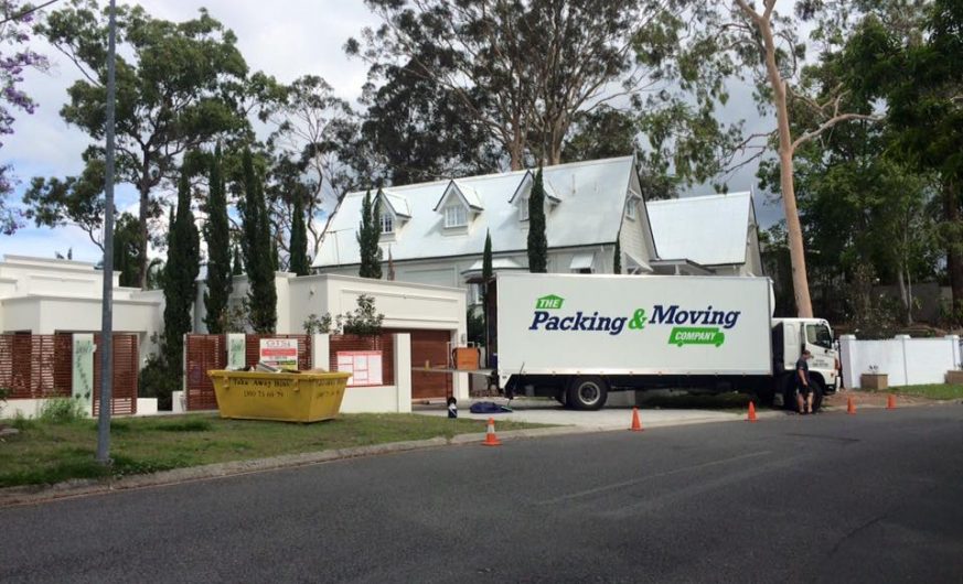 Moving Truck in Front of Large House — The Packing & Moving Company in Tanah Merah, QLD