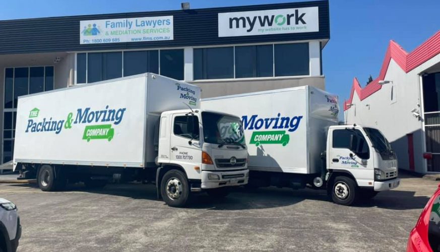 Side View of White Trucks — The Packing & Moving Company in Tanah Merah, QLD