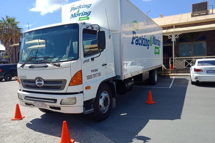 Truck Parked With Orange Cones — The Packing & Moving Company in Tanah Merah, QLD