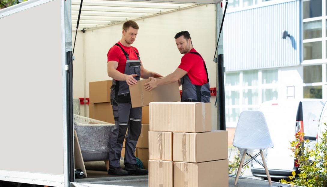 Movers Unloading The Boxes — The Packing & Moving Company in Tanah Merah, QLD